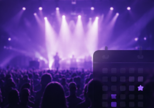 Concert crowd facing the stage with a calendar visual